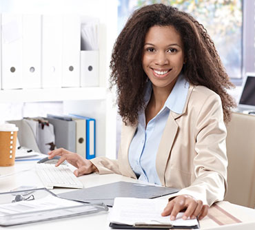 Graphic designer sitting at desk and computer